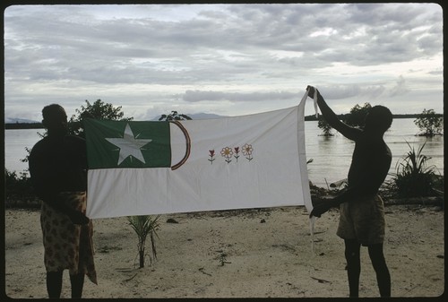 Men holding up a Christian Fellowship Church flag