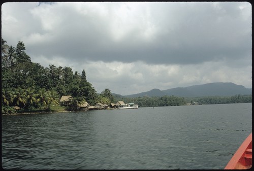 View of houses on the shoreline from a boat