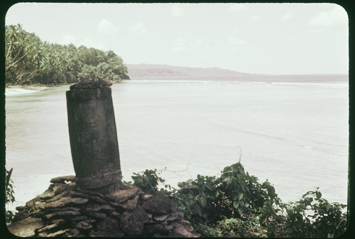 Dolo, or burial urn, chisled from a single block of limestone and set upon a pyramid of coral slab