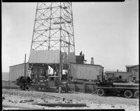 Base of oil well the Venice oil field with the ocean in background on the left, Los Angeles, 1930-1940