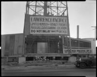 Oil well with advertisement, probably at the Venice or Playa del Rey oil field, Los Angeles, 1930