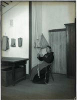 Monk working on cord-making at the Mission Santa Barbara, Santa Barbara, 1898