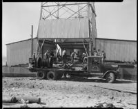 Base of oil well at the Venice oil field with the ocean in background on the left, Los Angeles, 1930-1940