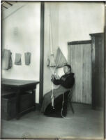 Monk working on cord-making at the Mission Santa Barbara, Santa Barbara, 1898