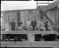 Group portrait at an oil well owned by the Bolsa Chica Oil Co., California, 1920-1939