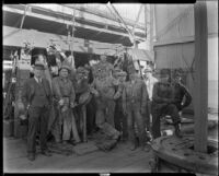 Group portrait of men on the drill floor of an oil rig at the Venice or Playa del Rey oil field, Los Angeles, circa 1930