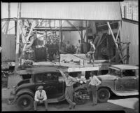 Workmen posed on the drill floor of an oil well, probably at the Venice or Playa del Rey oil field, Los Angeles, 1930