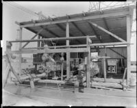 Mud pumps and mud tank at an oil well, California, 1930-1939