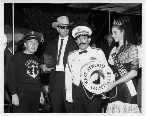 Photograph of West Atwood Yacht Club with Commodore J. Herringbone Tweed and Miss Placentia