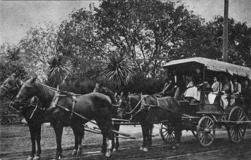 Photograph of horse-drawn carriage with high school students