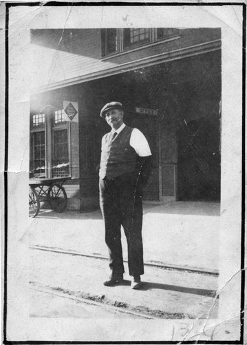 Photograph of William F. Andrus standing outside the Santa Fe Depot