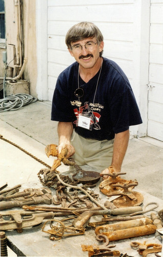 Photograph of Dave Fleming with old handtools