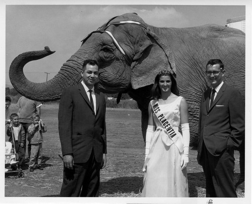 Photograph of Miss Placentia, Mayor Vic Michel, Tony Moreno and elephant