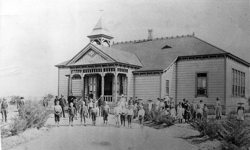 Photograph of Placentia Grammar School students and teachers standing in front of schoolhouse