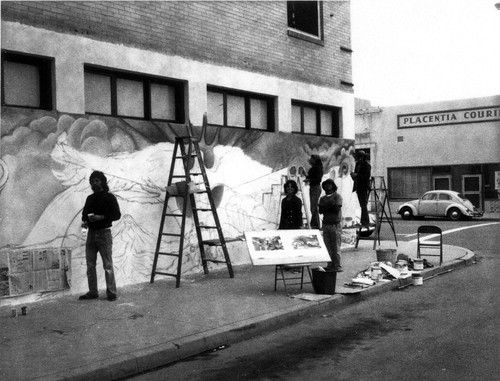 Photograph of art students painting wall mural