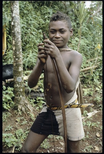 Young man with palmwood bow