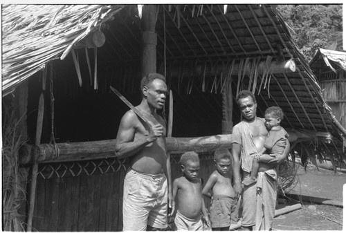 Family in front of house