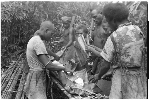 Making the taro and coconut puddings on platform near the sango dance ground