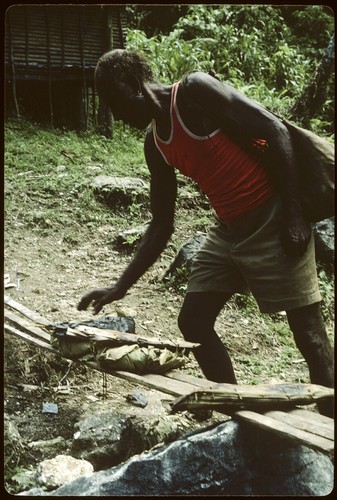 Man gathering wrapped food