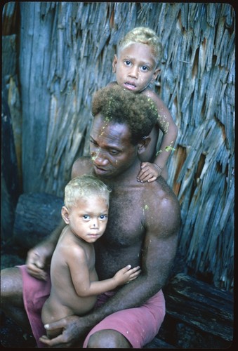 Man and two children