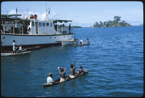 Canoe by a boat, probably at Lau Lagoon