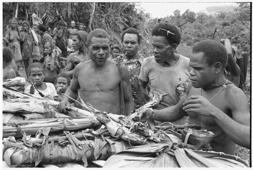 Fe'oka, man with patterned shirt is Basilamo, Batalamo's brother, and man with comb in hair and t-shirt is Asuabe'u