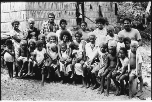 Group portrait; woman, men and children