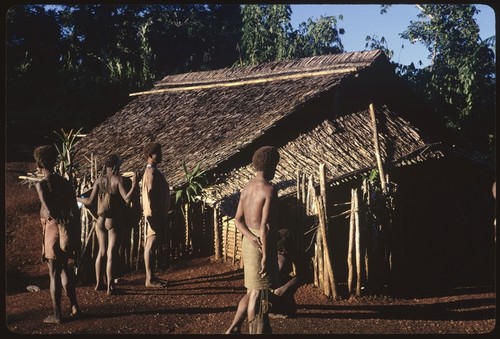 People in front of house