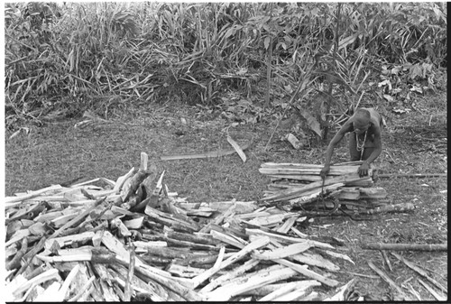 Woman chopping firewood