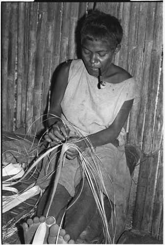 Moruka of Ga'enaafou, 'Elota's daughter, plaiting a bag