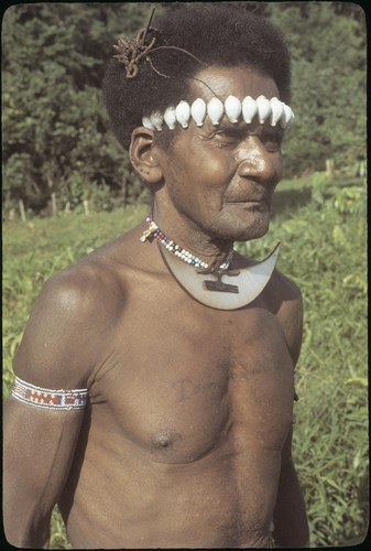 Man with dafi on neck and tale'ekalango on forehead