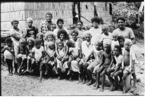 Group portrait; woman, men and children