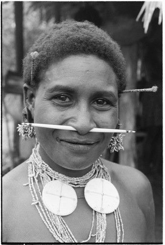 Oiru'a, wearing fio nose pin, 'ausakwalo earsticks, girigwei'a clamshell pendants, kwari'ingari nut and bat-tooth ear ornaments