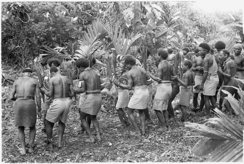 Sango dancers prepare to enter the dance ground