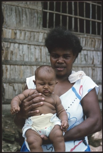 Woman and infant at Gounaabusu, South Sea Evangelical Church village at Sinalagu Harbour