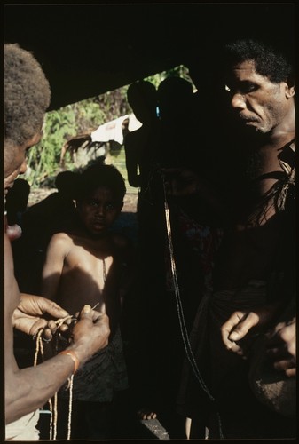 Dangeabe'u and another man, with red aru and white kofu shell money strings