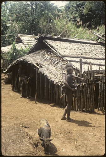 Woman carrying child