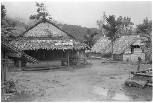 Large slitgong in what appears to be a coastal Christian village, likely not in Kwaio