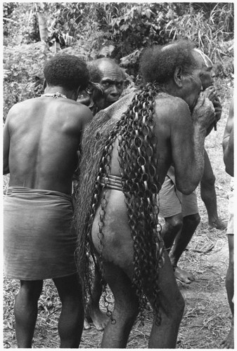 Men play panpipes to accompany the sango dance at Ngarinaasuru, probably 1977