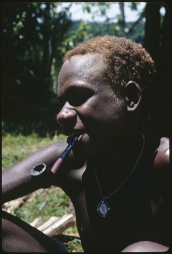 Portrait of young man with pipe