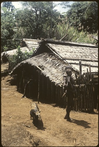 Woman carrying child