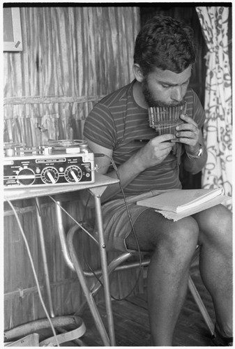 European man with panpipes in Keesing's house