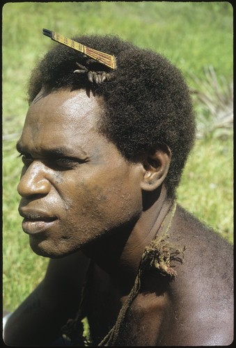 Man with faa plaited ornamental comb