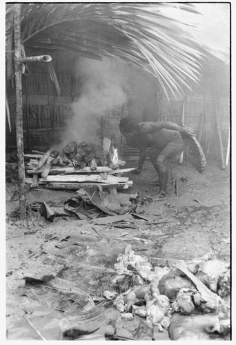 Fire for heating stones at mortuary feast given by Tome Arika for the death of his sister