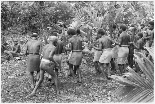 Sango dancers preparing to enter the dance ground; they begin with a song