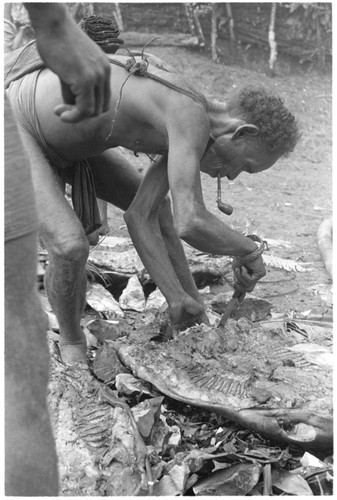 Elota with pork at a mortuary feast he is sponsoring