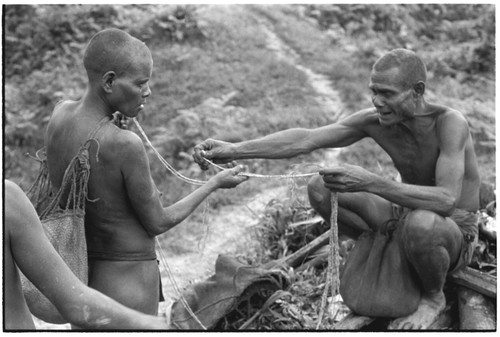 Woman giving money to Joe Bono