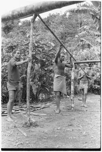 Men working on house frame