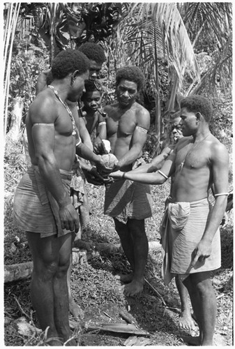 Ritually breaking coconut