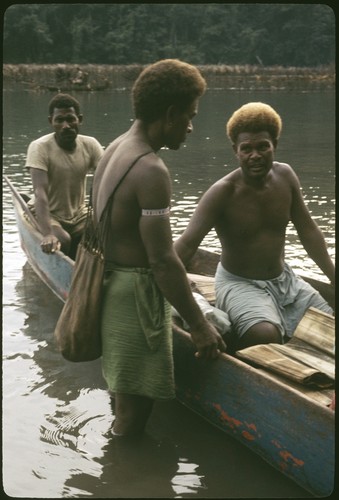 People arriving in canoe